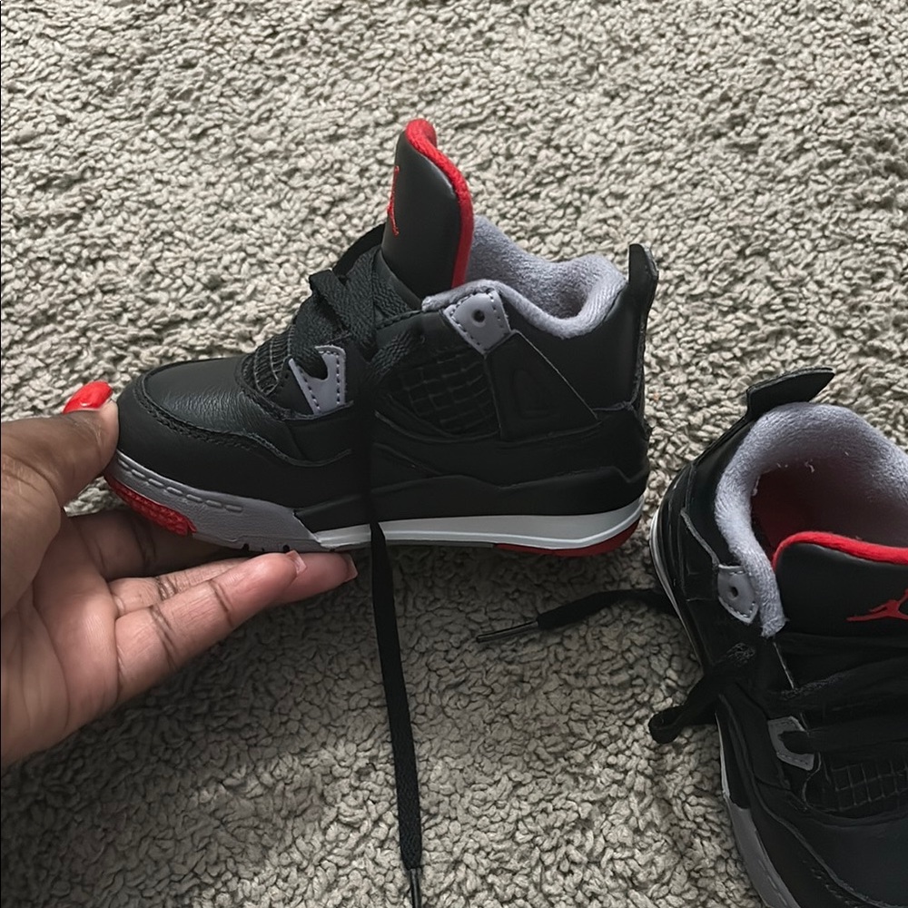 Jordan Black and Red Sneakers with Athletic Silhouette